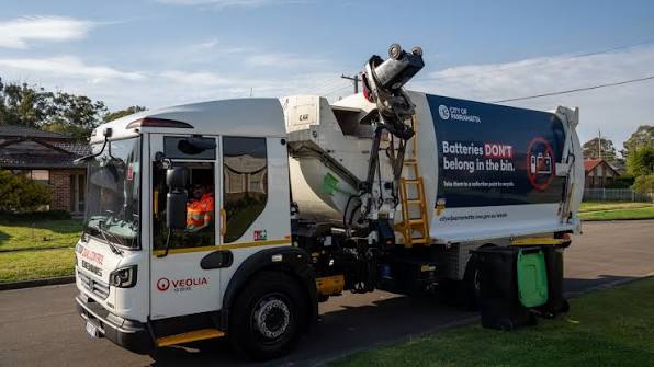 A PUMA Solutions removal crew loading a trailer